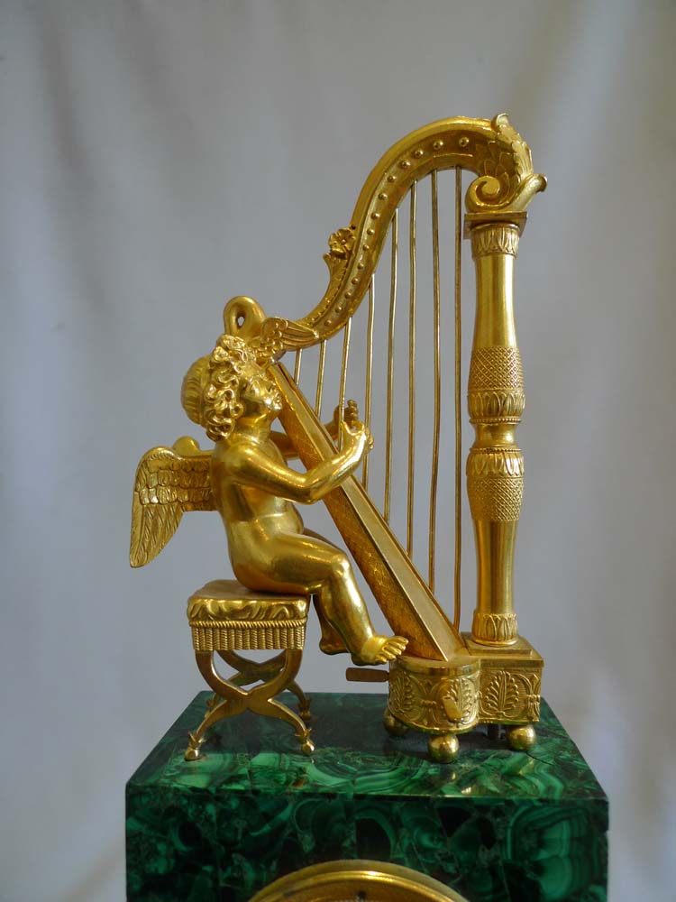 Antique Russian malachite and gilt bronze mantel clock.