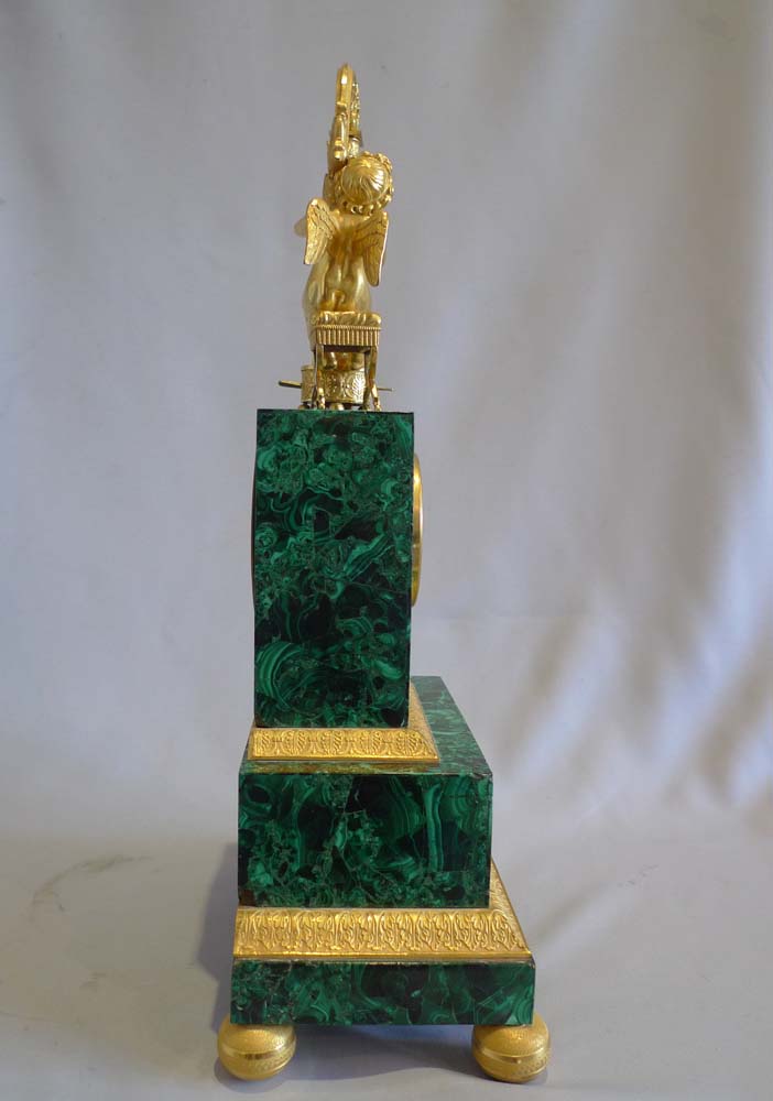 Antique Russian malachite and gilt bronze mantel clock.