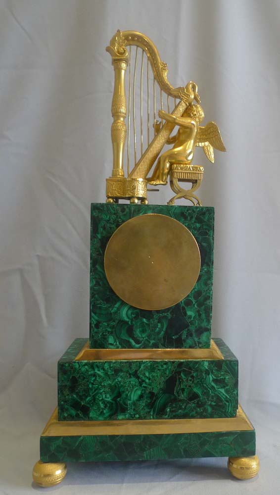 Antique Russian malachite and gilt bronze mantel clock.