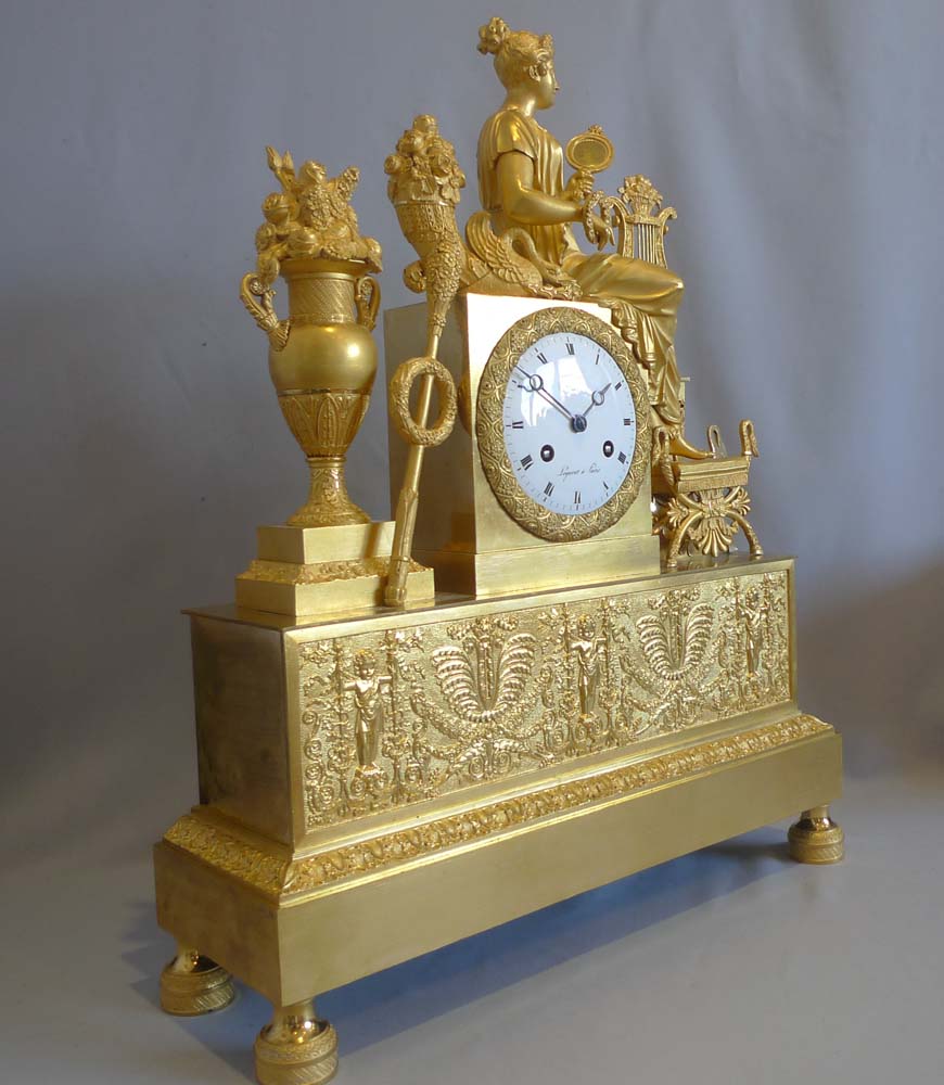French Empire ormolu mantel clock depicting vanity?.
