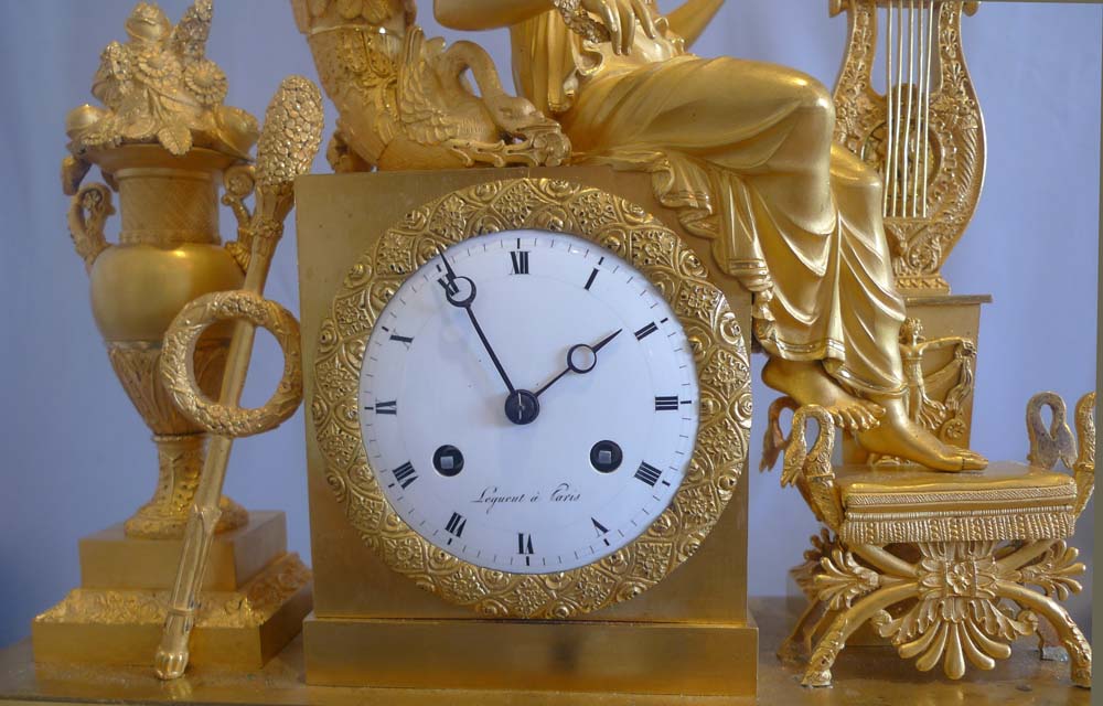 French Empire ormolu mantel clock depicting vanity?.