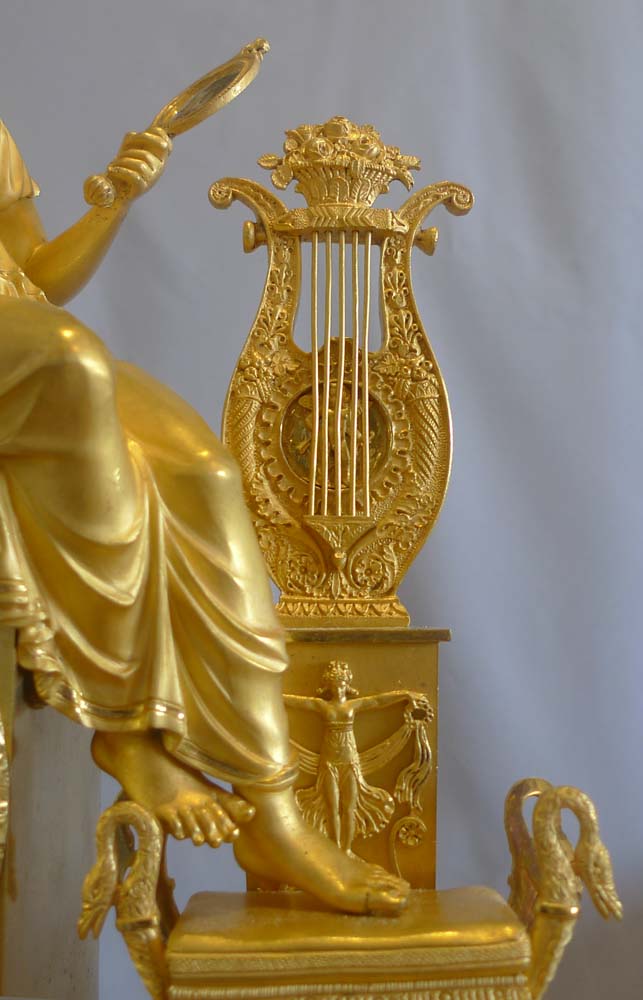 French Empire ormolu mantel clock depicting vanity?.