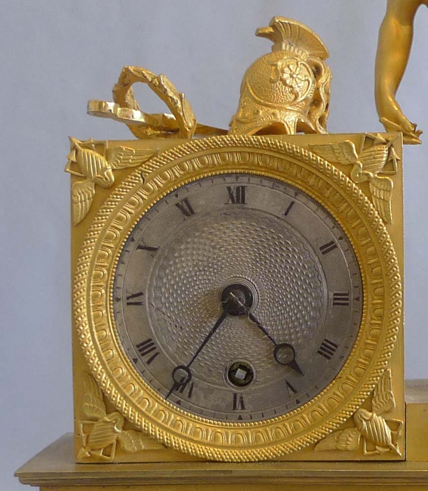 Antique French Empire ormolu mantel clock of Roman with coins.