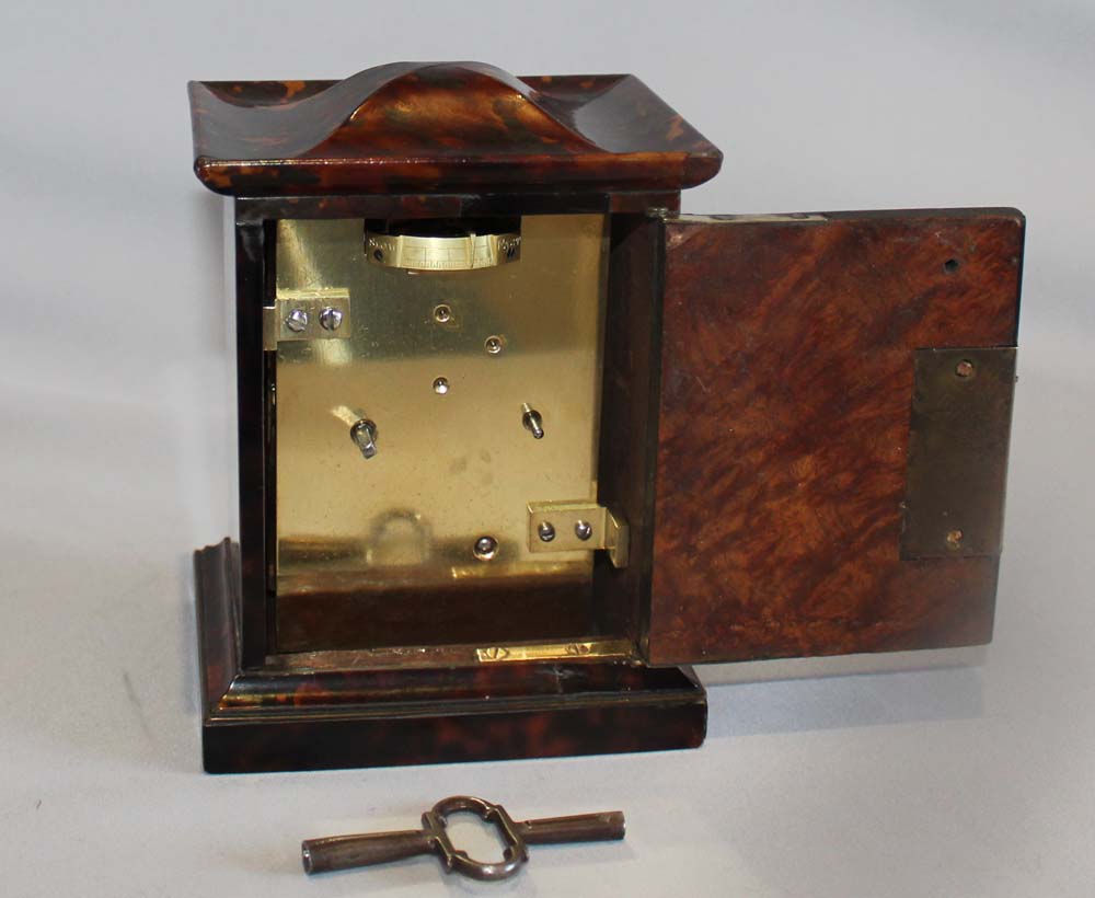 English late Regency antique miniature fusee carriage clock in tortoiseshell veneered case.