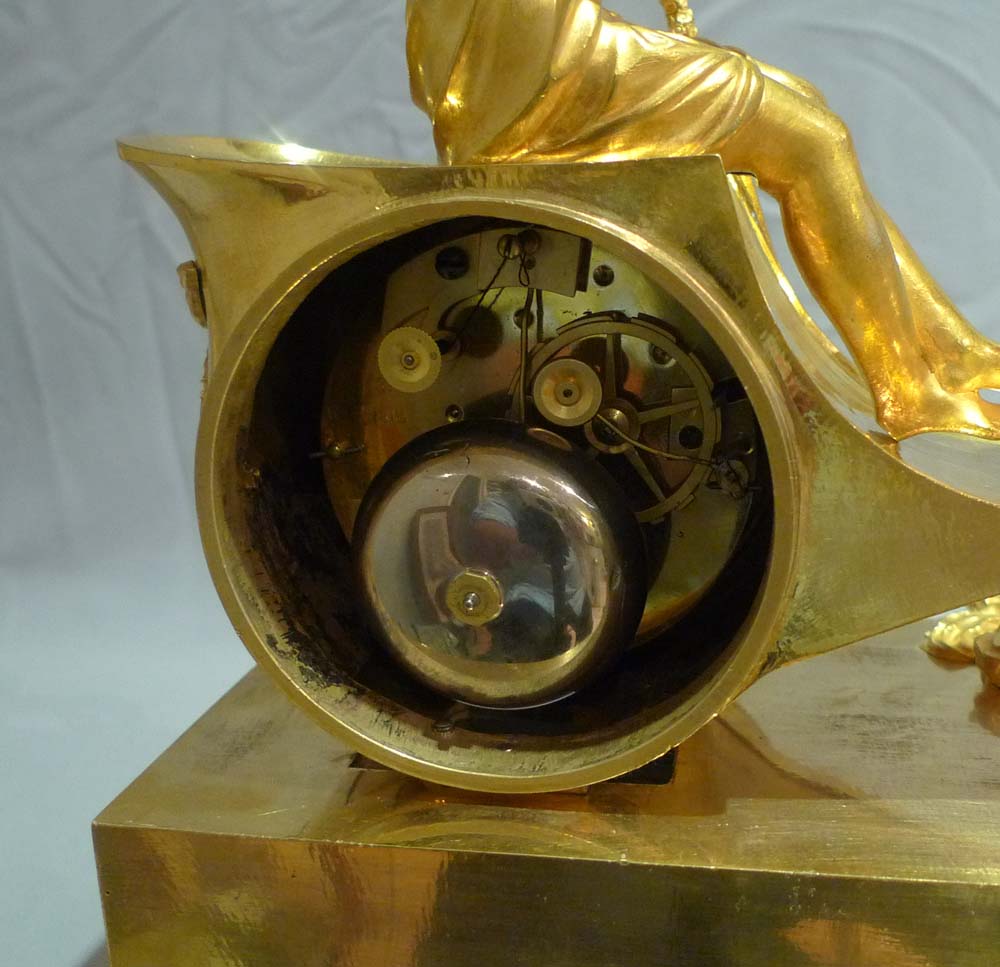 Antique French Empire chariot clock in ormolu signed Ravrio.