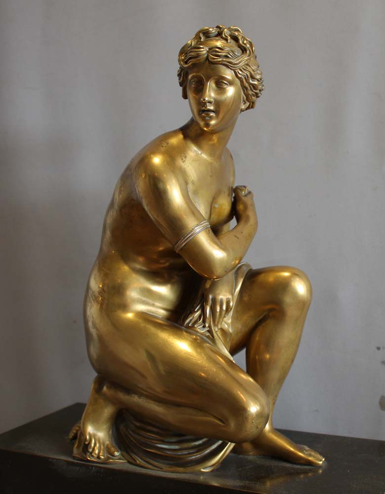 French Charles X mantel clock with Grand Tour Crouching Venus, patinated bronze and ormolu.