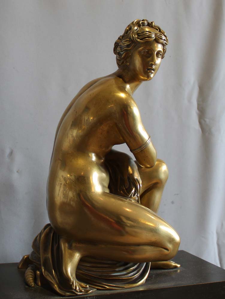 French Charles X mantel clock with Grand Tour Crouching Venus, patinated bronze and ormolu.
