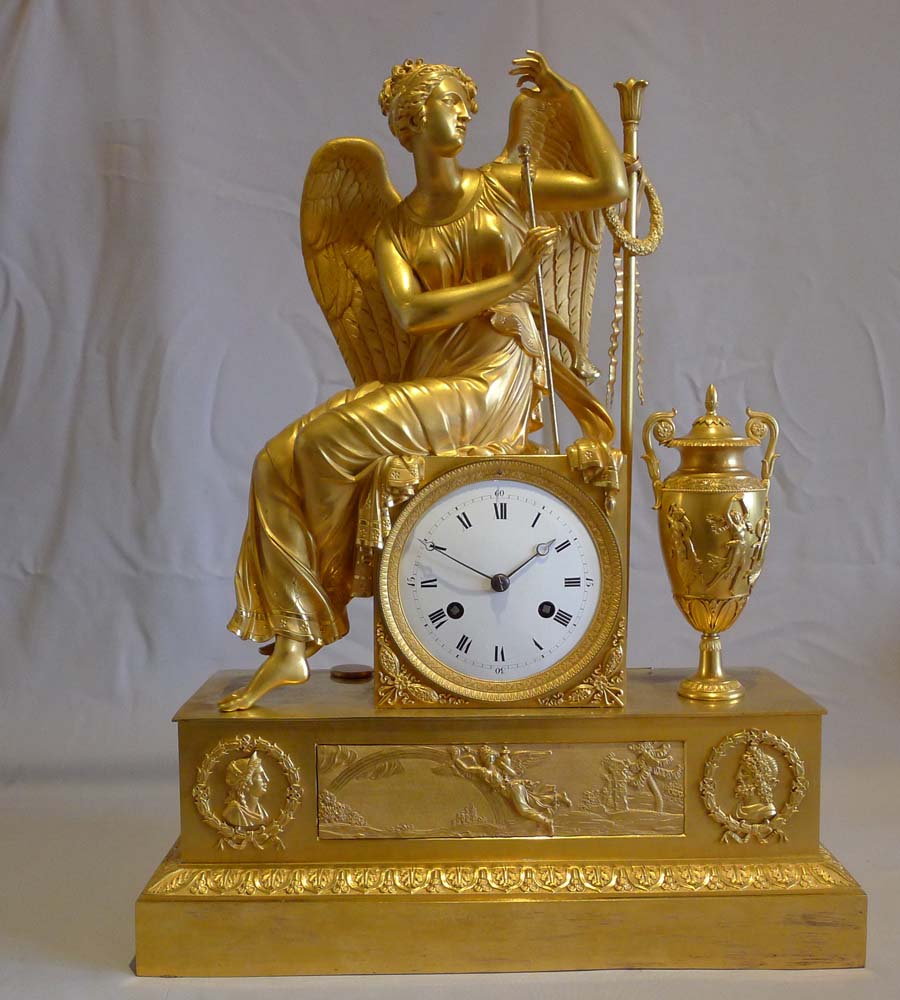 Antique French Empire ormolu mantel clock of winged goddess..