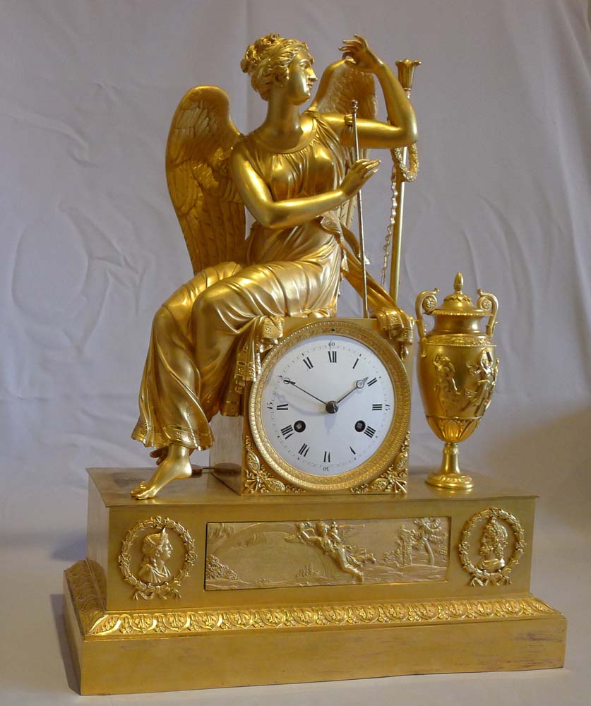 Antique French Empire ormolu mantel clock of winged goddess..