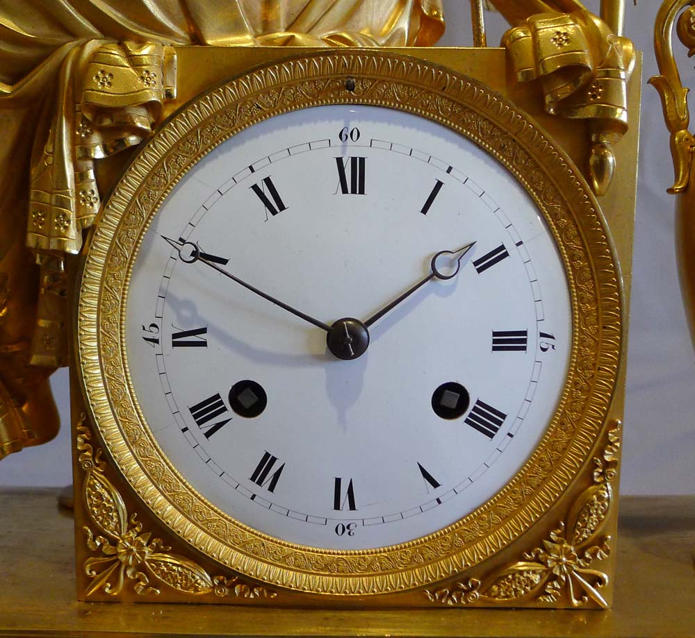 Antique French Empire ormolu mantel clock of winged goddess..