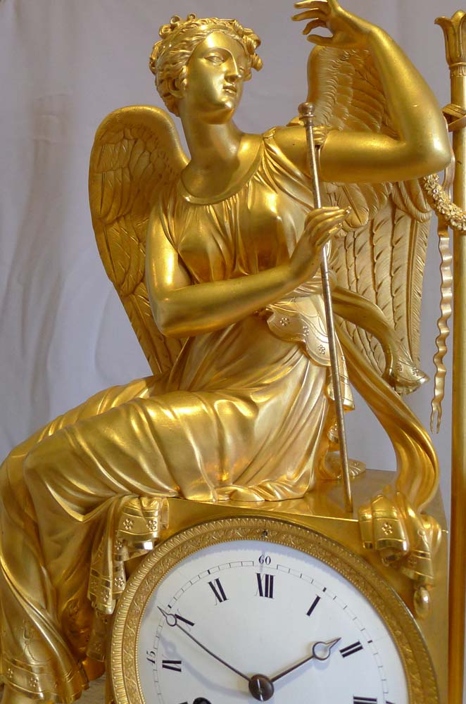 Antique French Empire ormolu mantel clock of winged goddess..