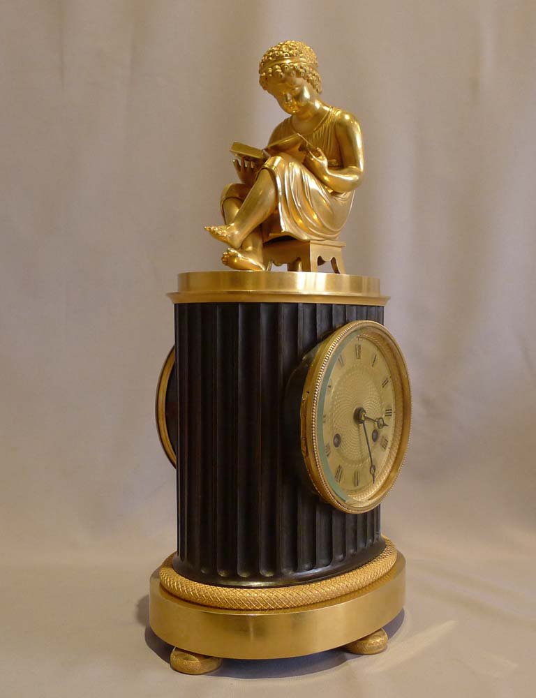 Antique French Empire library clock of a child reading..