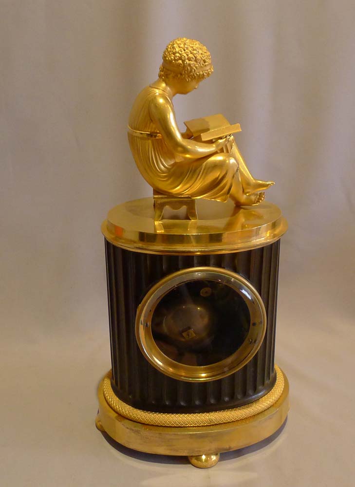 Antique French Empire library clock of a child reading..