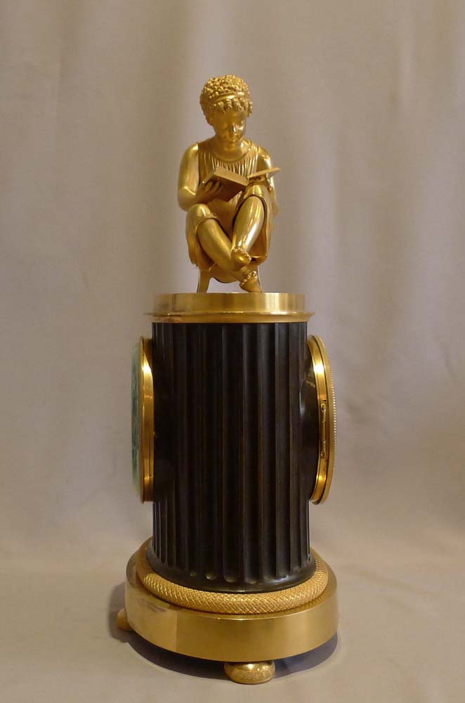 Antique French Empire library clock of a child reading..