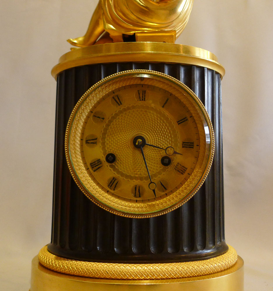 Antique French Empire library clock of a child reading..