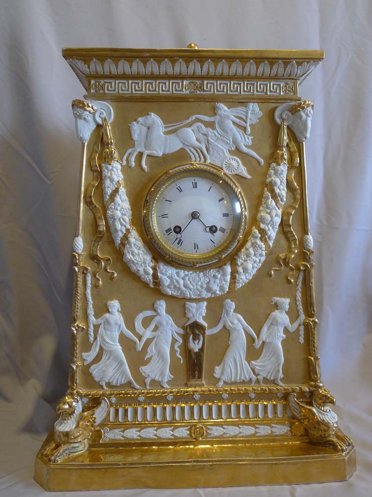 Antique Neo-classical gilded and natural bisque mantel clock.