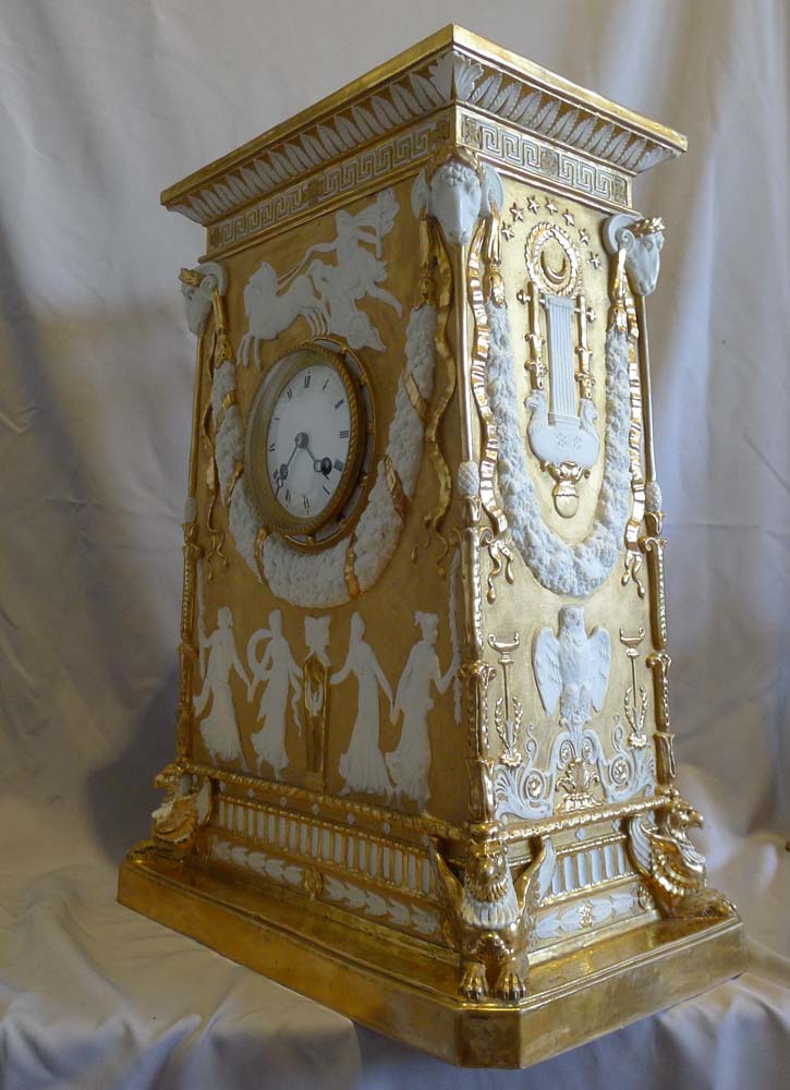 Antique Neo-classical gilded and natural bisque mantel clock.
