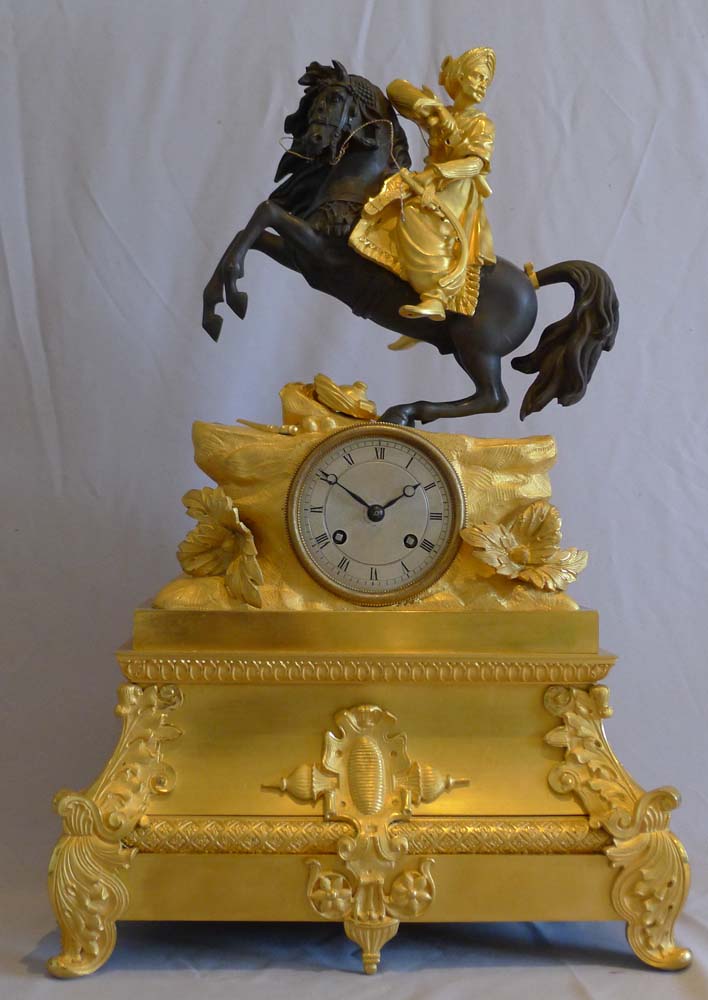 Antique French Greek Revolution or Hellenistic mantel clock of Turk on horseback.
