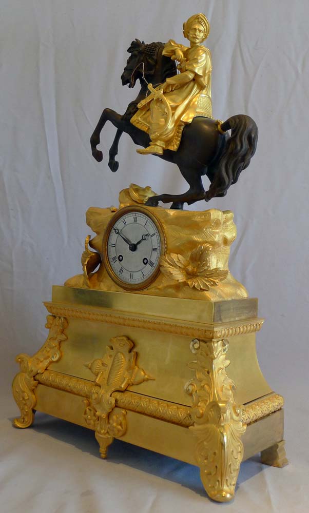 Antique French Greek Revolution or Hellenistic mantel clock of Turk on horseback.