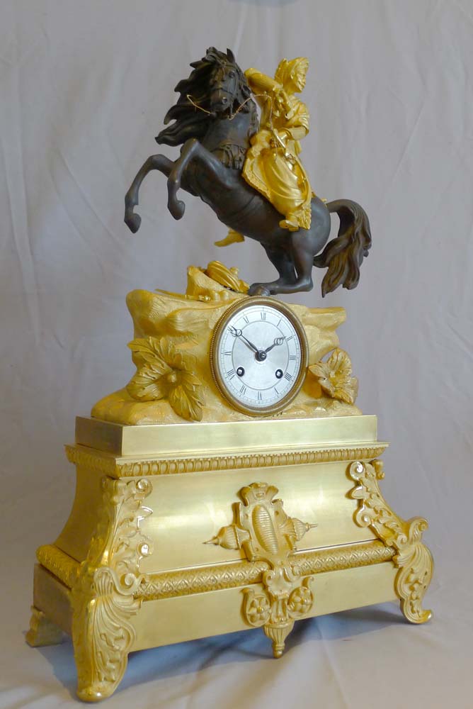Antique French Greek Revolution or Hellenistic mantel clock of Turk on horseback.