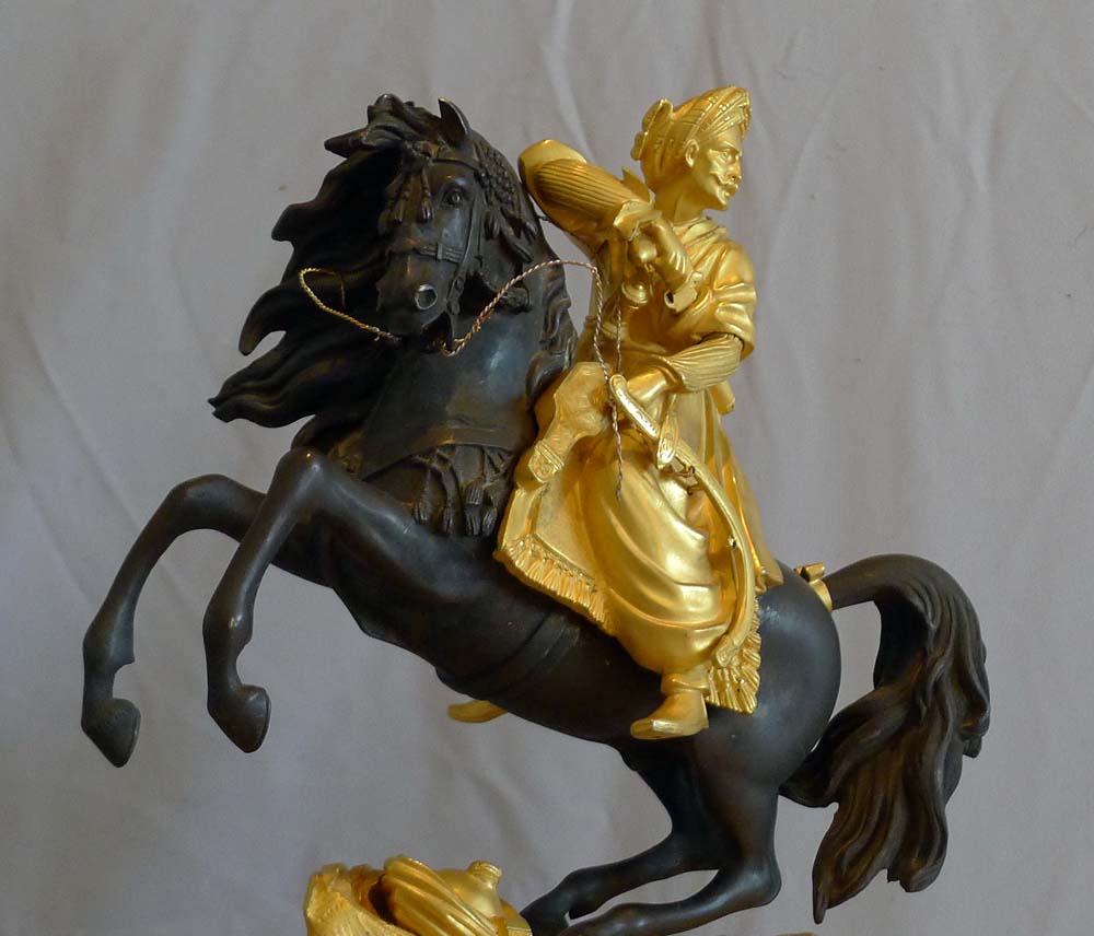 Antique French Greek Revolution or Hellenistic mantel clock of Turk on horseback.