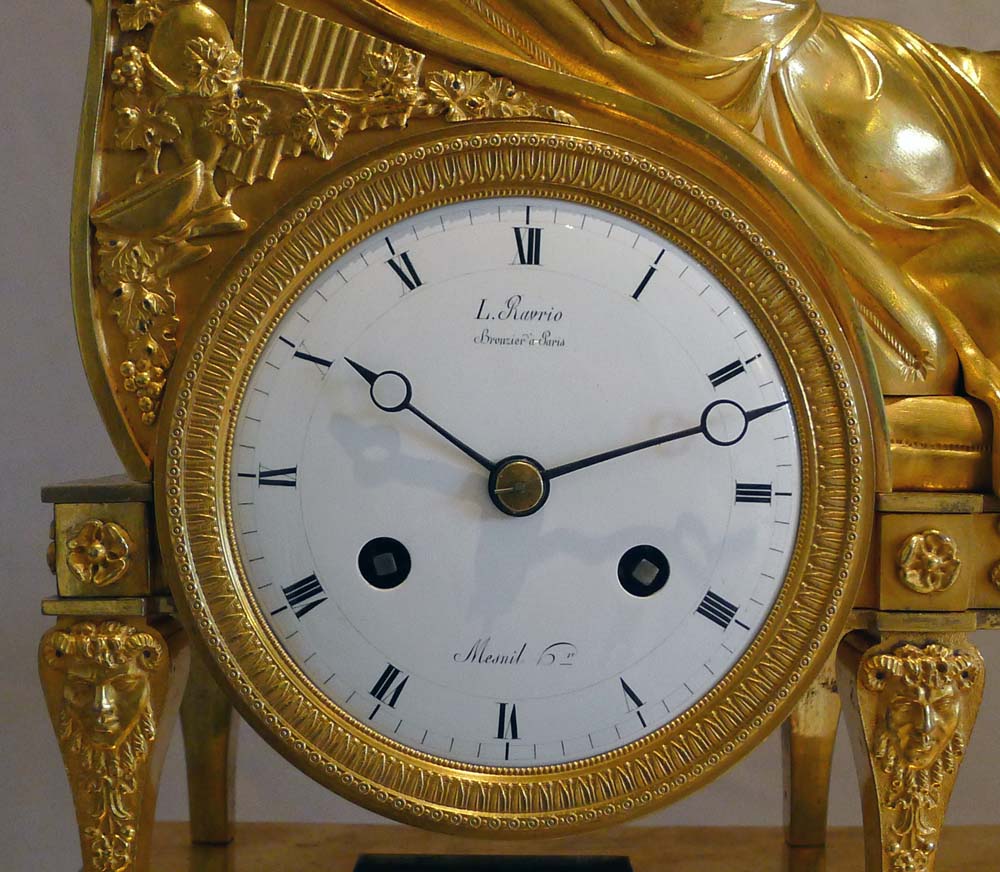 Antique French Empire clock of a Bacchante lying on her day bed.