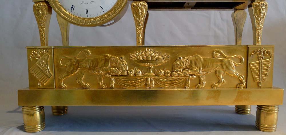 Antique French Empire clock of a Bacchante lying on her day bed.