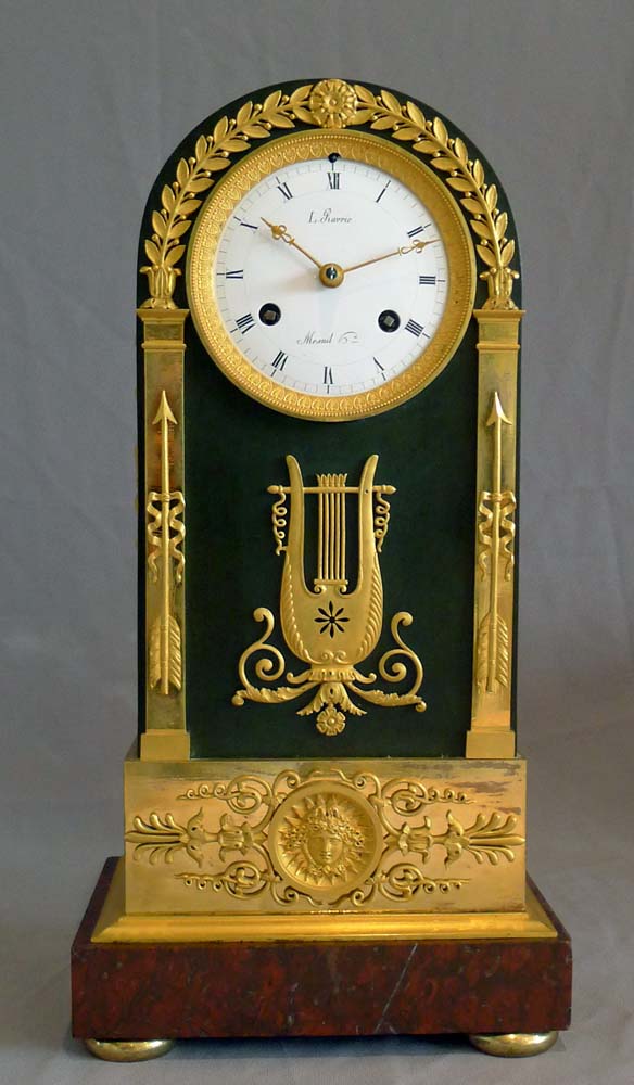French Empire antique clock, ormolu, patinated bronze and marble signed by both Ravrio and Mesnil.