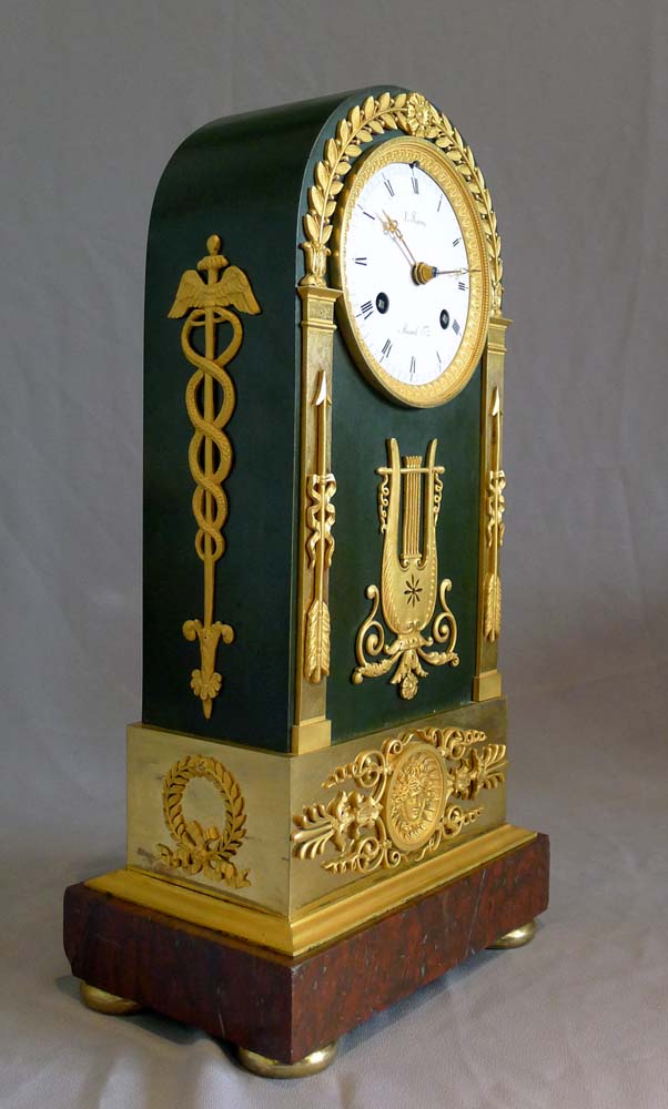 French Empire antique clock, ormolu, patinated bronze and marble signed by both Ravrio and Mesnil.
