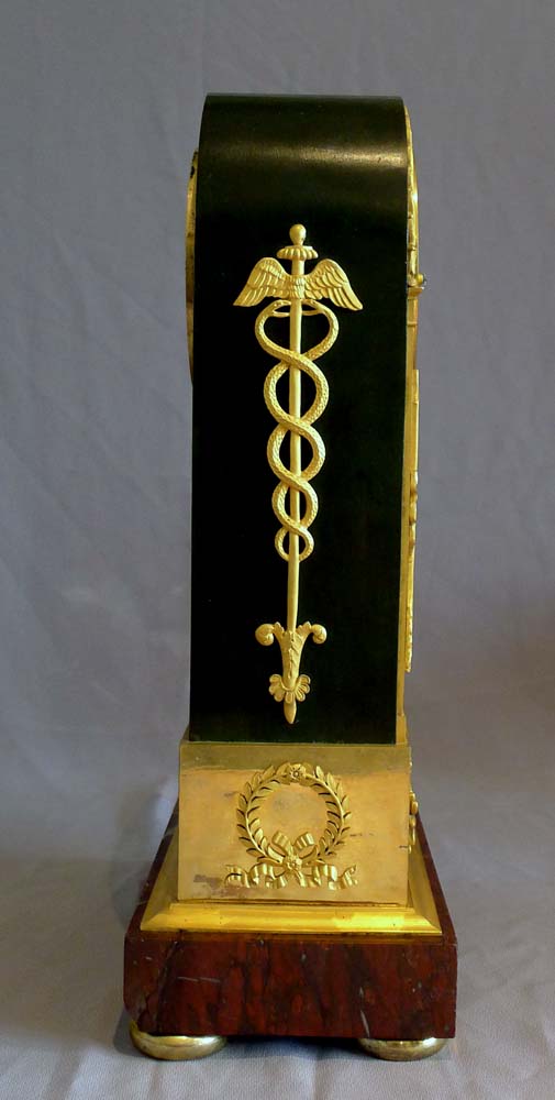 French Empire antique clock, ormolu, patinated bronze and marble signed by both Ravrio and Mesnil.