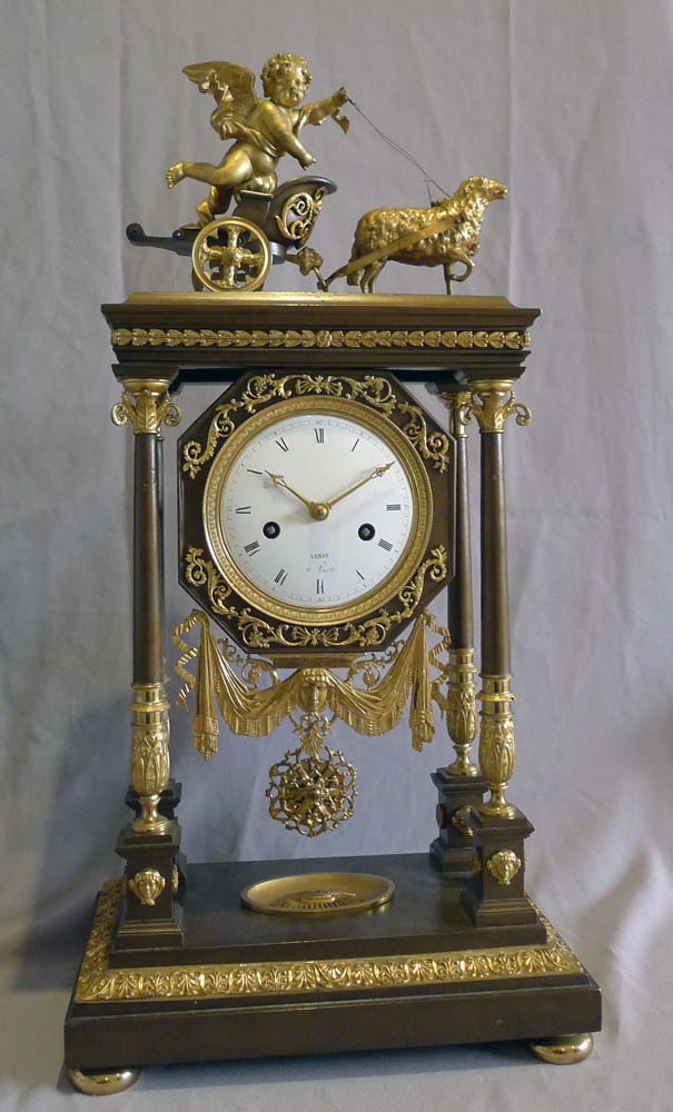 Antique French Empire Portico clock by Leroy in patinated bronze and ormolu..