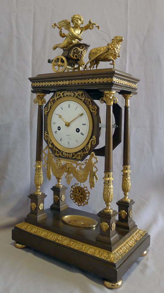 Antique French Empire Portico clock by Leroy in patinated bronze and ormolu..