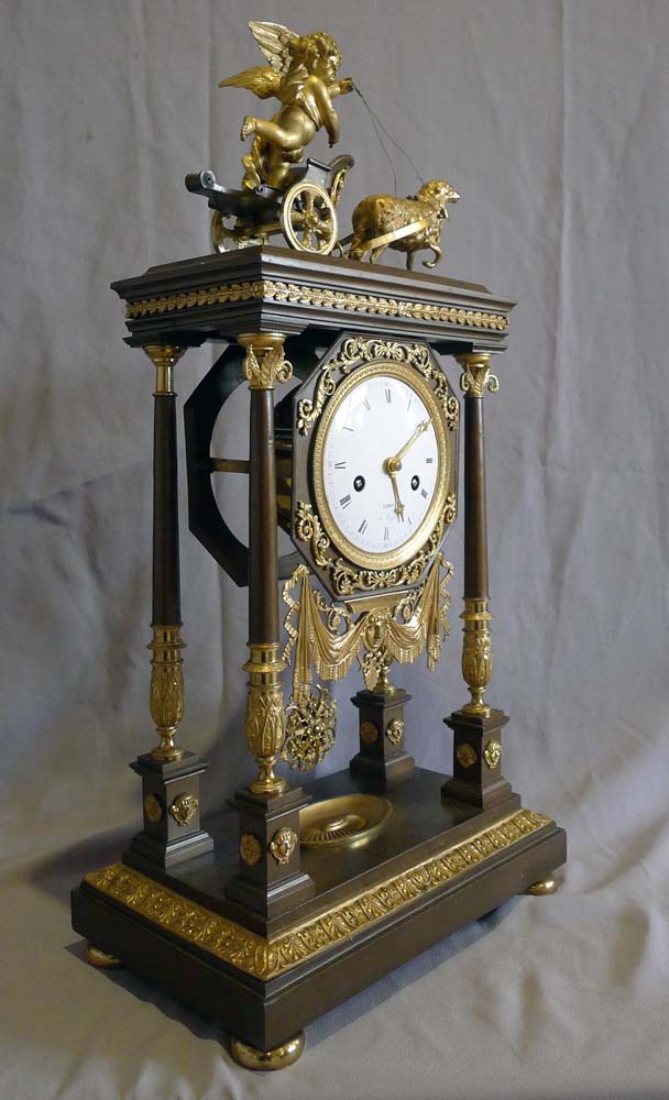 Antique French Empire Portico clock by Leroy in patinated bronze and ormolu..