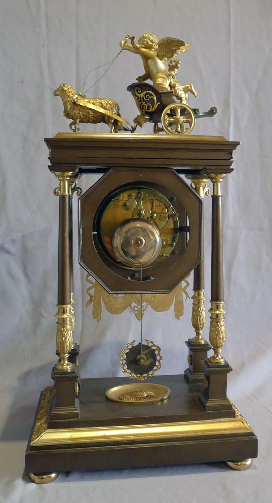 Antique French Empire Portico clock by Leroy in patinated bronze and ormolu..