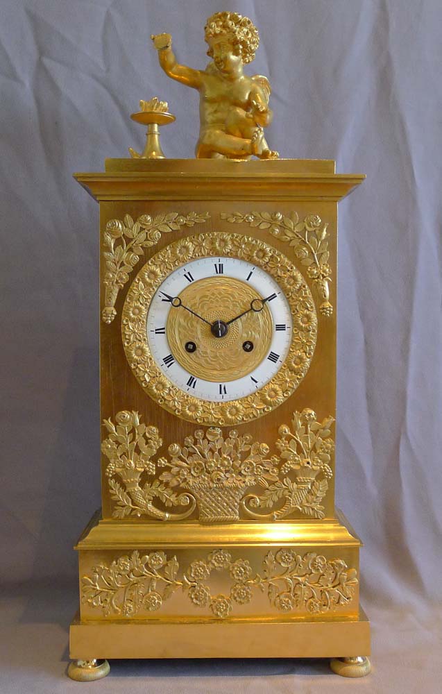Antique French Charles X ormolu mantel clock depicting Love.