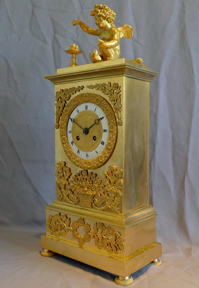 Antique French Charles X ormolu mantel clock depicting Love.
