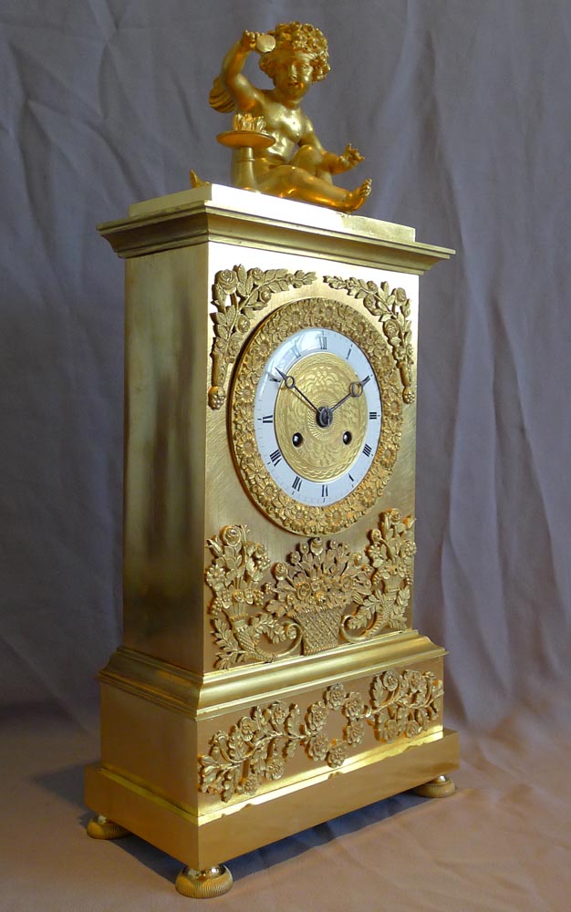 Antique French Charles X ormolu mantel clock depicting Love.