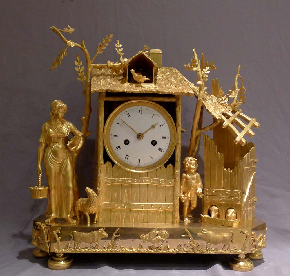 Antique French Empire ormolu mantel clock of the Arcadian Genre.