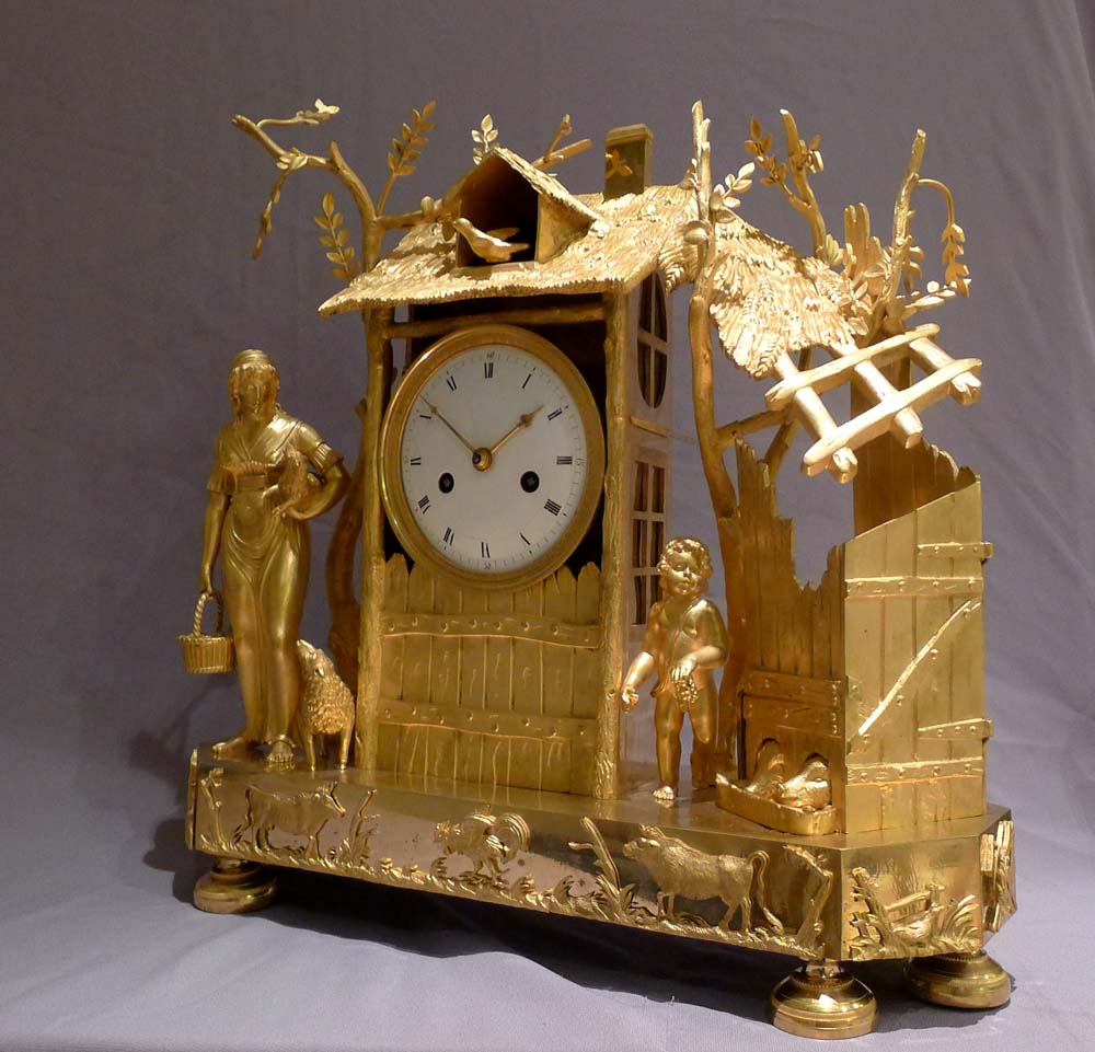 Antique French Empire ormolu mantel clock of the Arcadian Genre.
