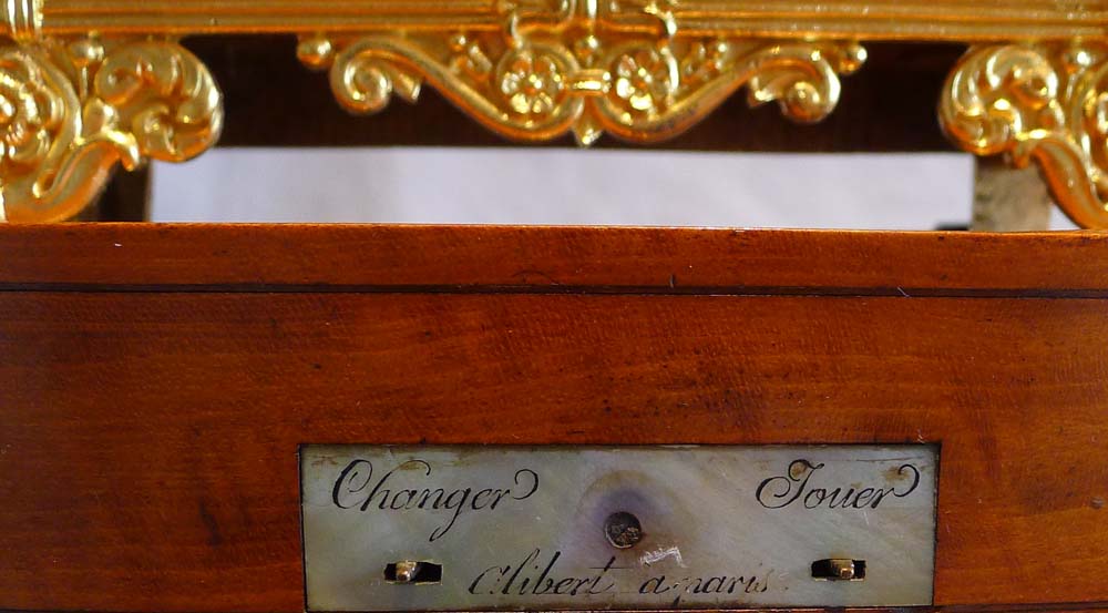 Antique Charles X  miniature ormolu clock of Pandora on musical base by Alibert.