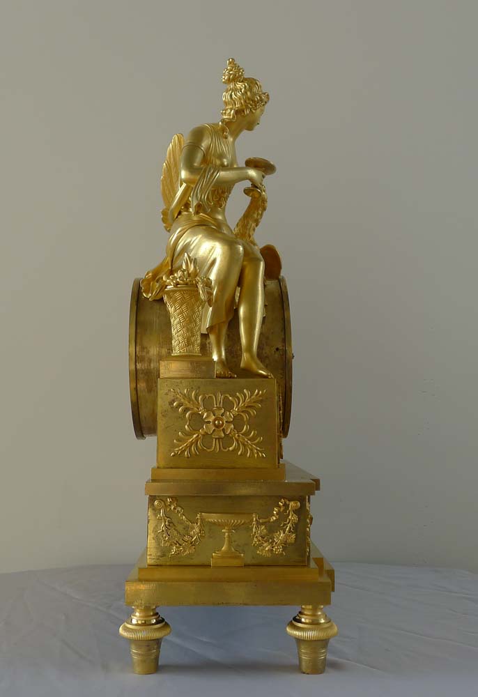 Antique French Empire ormolu clock depicting the goddess Juno or Hera.