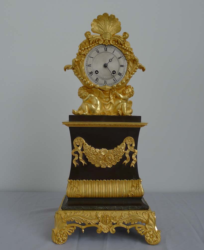 Antique Charles X patinated bronze and ormolu clock signed Pinedde a Poitiers.