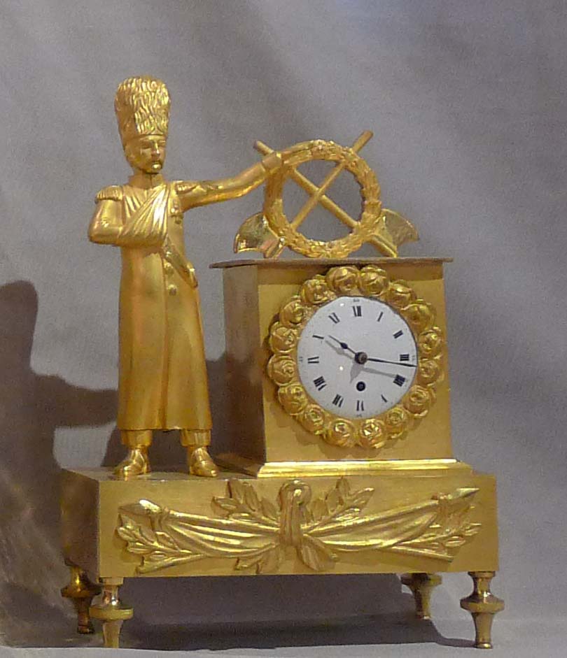 Miniature French Empire ormolu mantel clock of soldier.