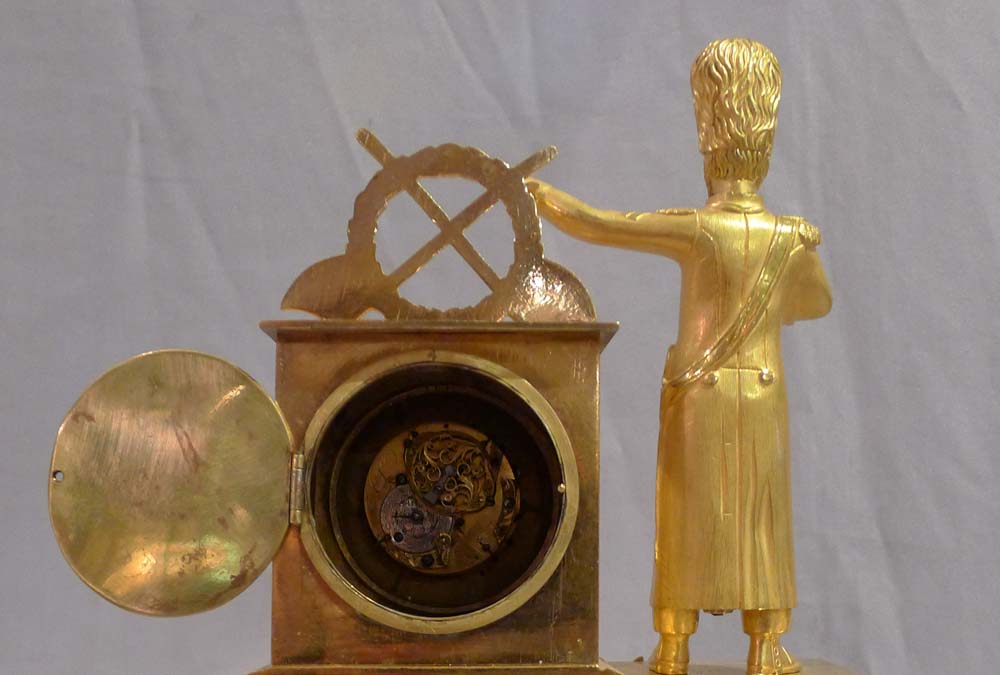Miniature French Empire ormolu mantel clock of soldier.