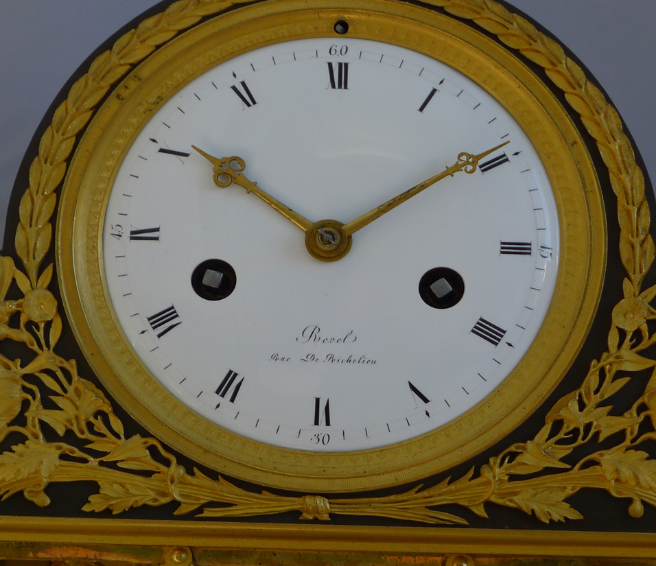 Antique French Empire mantel clock in ormolu and patinated bronze signed  Revel Rue De Richelieu