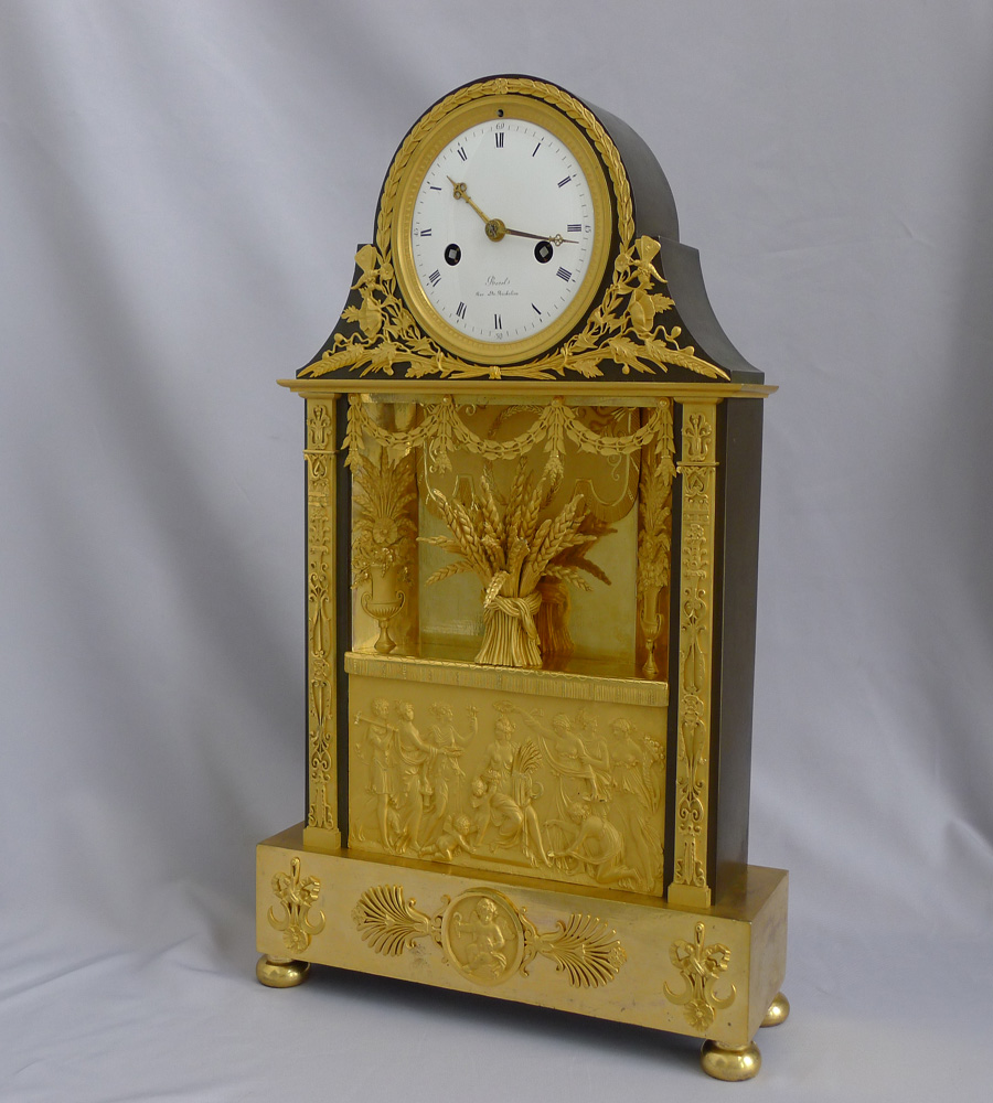Antique French Empire mantel clock in ormolu and patinated bronze signed  Revel Rue De Richelieu