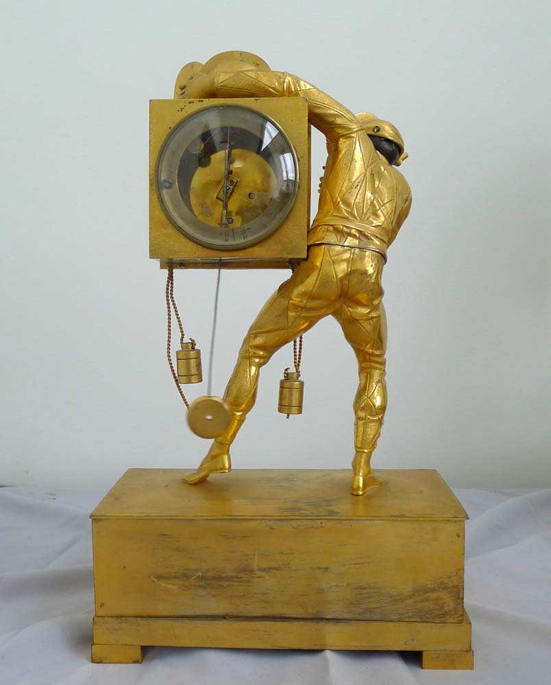 A fine Restoration or Charles X ormolu Harlequin clock.