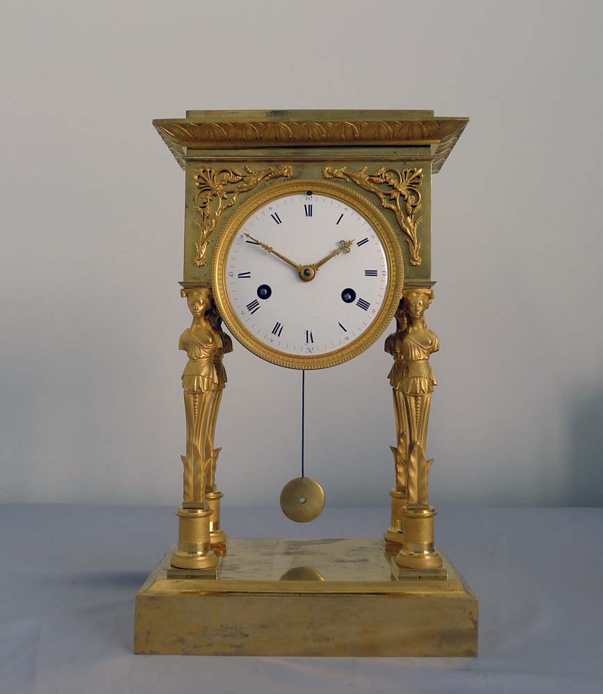 Antique French Empire ormolu portico clock.
