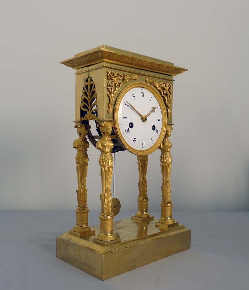 Antique French Empire ormolu portico clock.