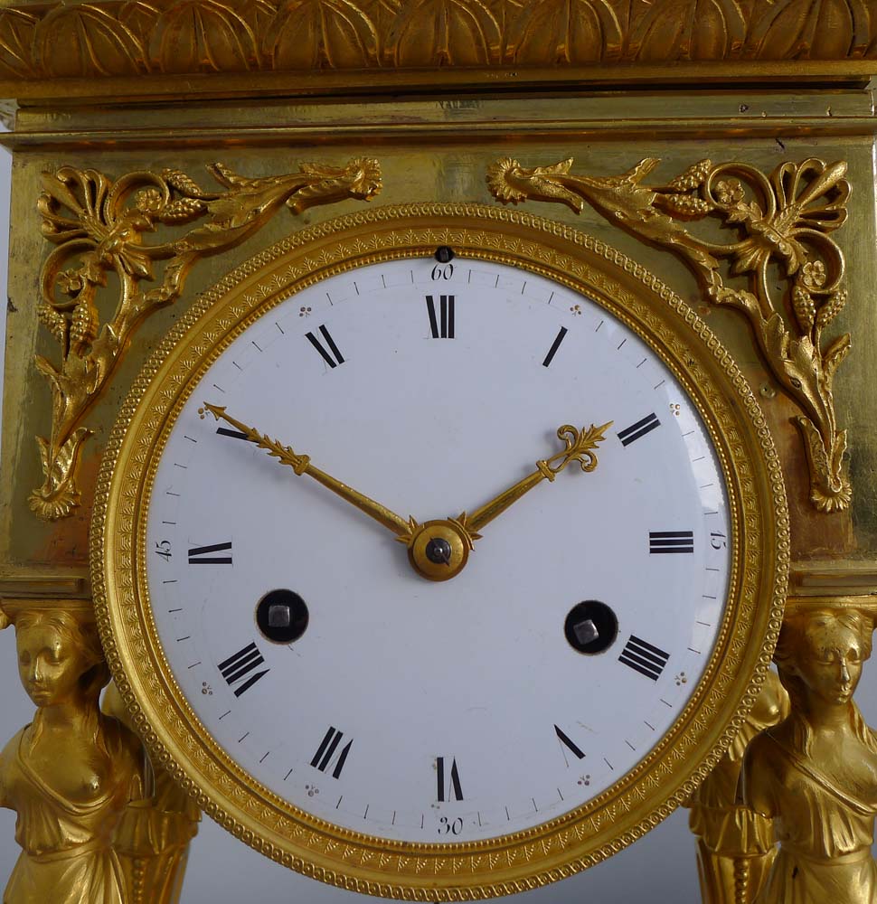 Antique French Empire ormolu portico clock.